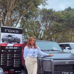 Achlyne Mpeke Sales Representative Showroom ABN Motors devant le SUV ROX 01 à partir de 63 000 000 FCFA TTC à Douala Cameroun